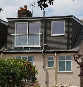 A Flat Roof Dormer Loft Conversion in Bristol with a juliet balcony