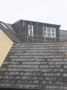 An in progress grey Flat Roof Dormer Loft Conversion in Bristol